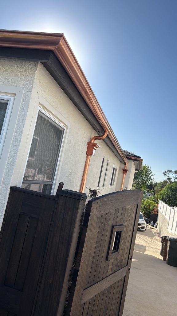 Copper downspout and gutter elbow detail