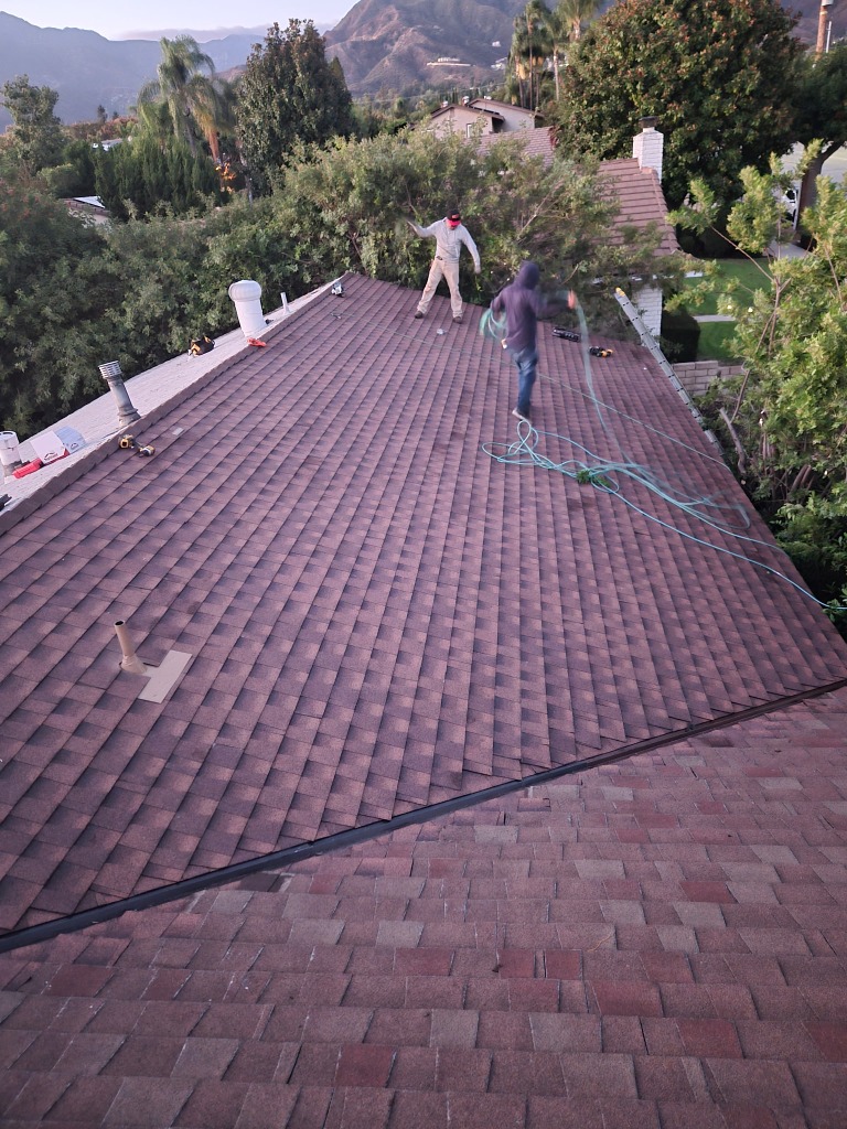 Composition shingle roof installation in progress
